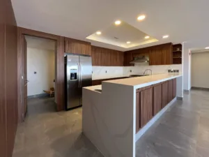 The refrigerator is seamlessly built into the cabinetry