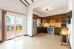 M2 Tamarindo, Rancho el Descanso - Kitchen with access to patio