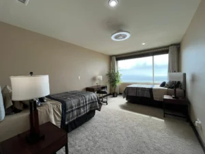 a room with two beds and oceanviews