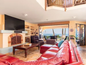 A glass wall with side-door gives access to the semi-private oceanfront patio.