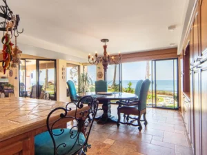 The spacious oceanfront dining area, opens to the garden patio.