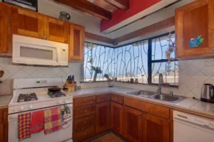 The kitchen features a corner window for extra ocean views - Plaza del Mar Real Estate
