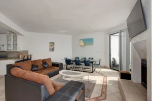The living, dining, and kitchen areas transition naturally into one another.