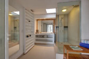 The principal ensuite has a glass shower.