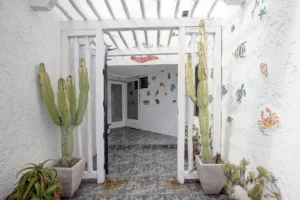 The entrance is warmly illuminated, creating an inviting first impression.