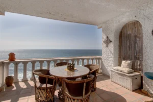 A traditional Mexican banister enhances the outdoor space