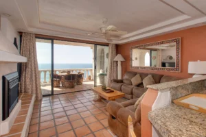 Living area, with tall, wide patio sliders to take in the views.