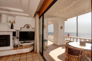 The patio sliders open to seamlessly connect the living area with the outdoors.