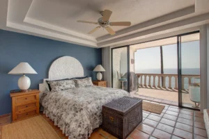 The principal bedroom offers ocean views right from the headboard.