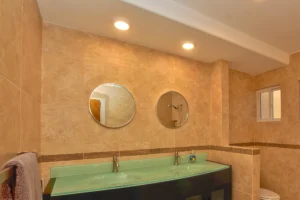 Master bathroom with double vanity (downstairs unit).