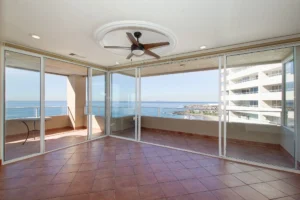 Two connected terraces create a wrap-around outdoor living experience