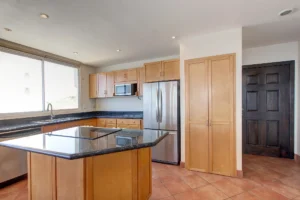 The kitchen features a modern open-concept design