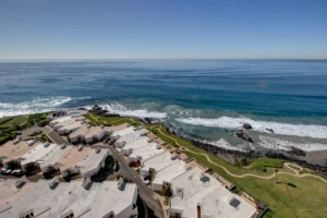 Condo 1002, Tower 2 – View from the 10th floor shows beach, walkway & villas.