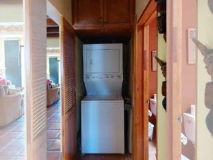 There is a dedicated closet with a washer and dryer