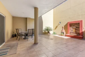 The adjacent patio offers incredible flexibility for outdoor dining, family gatherings, pets, or play