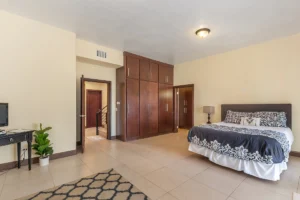 The bedroom features generous floor space, closet space and tall ceilings