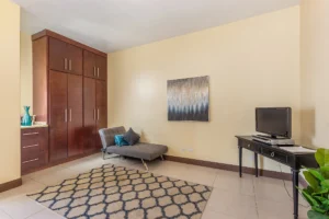 Tall ceilings enhance the spacious main bedroom