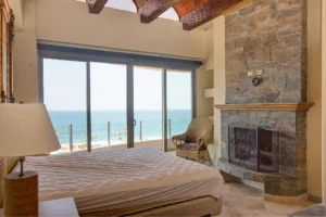 401 Mision Viejo, Rosarito - The bedroom also includes a cozy fireplace.