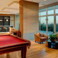 Two pool tables, satellite TV, couches, wood flooring full glass wall. Two pool tables, satellite TV, couches, wood flooring full glass wall.
